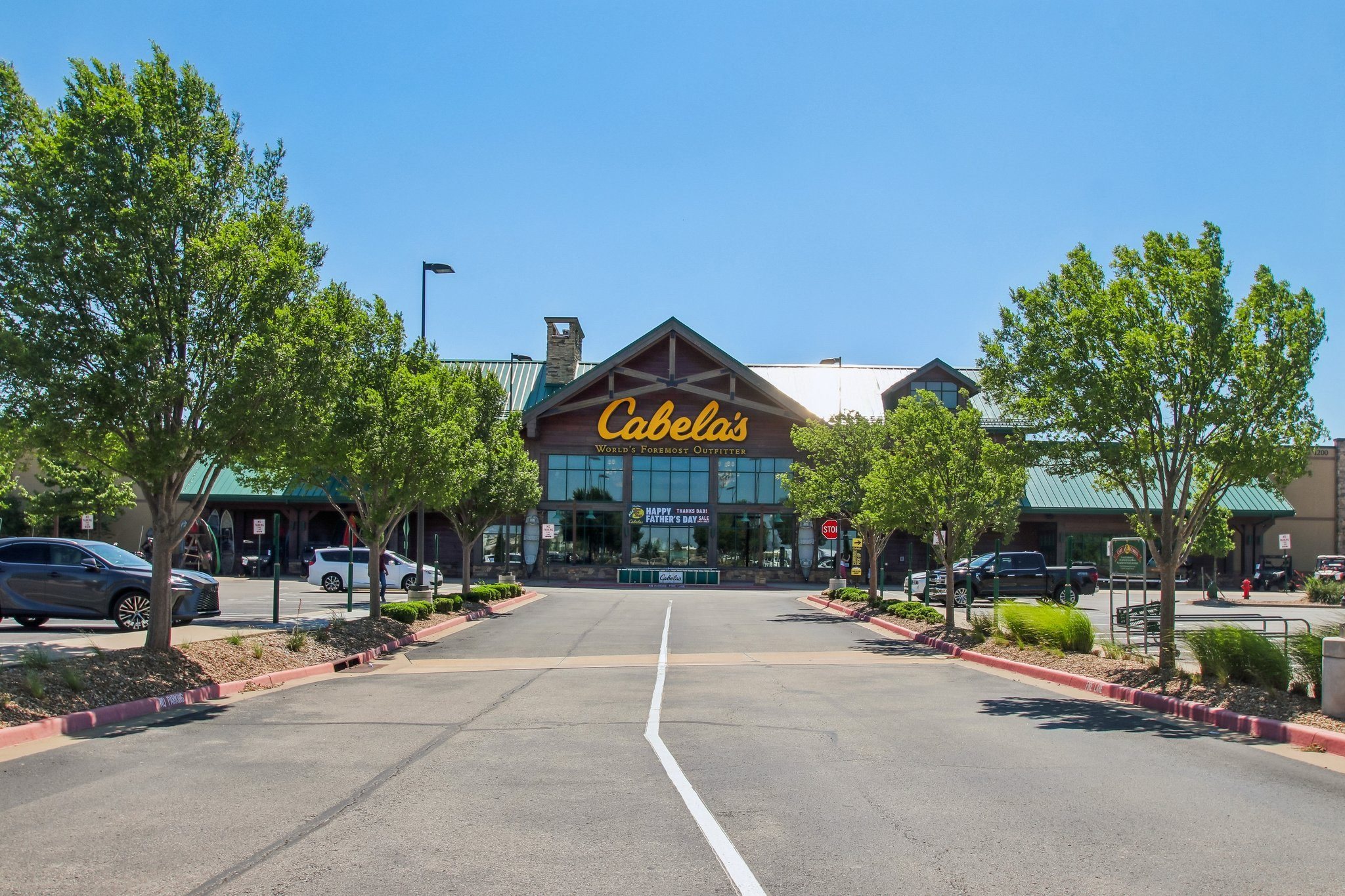 A view of a parking lot with a Celestis building in the background.